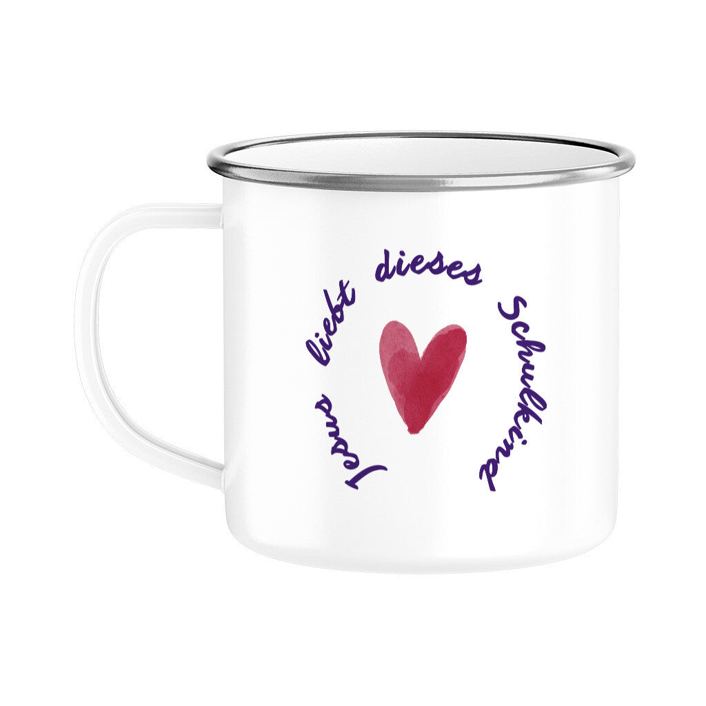 Jesus liebt dieses Schulkind:
Weiße Kindertasse zur Einschulung mit dem Spruch „Jesus liebt dieses Schulkind“, lila Schriftkreis und rotem Herz in der Mitte.