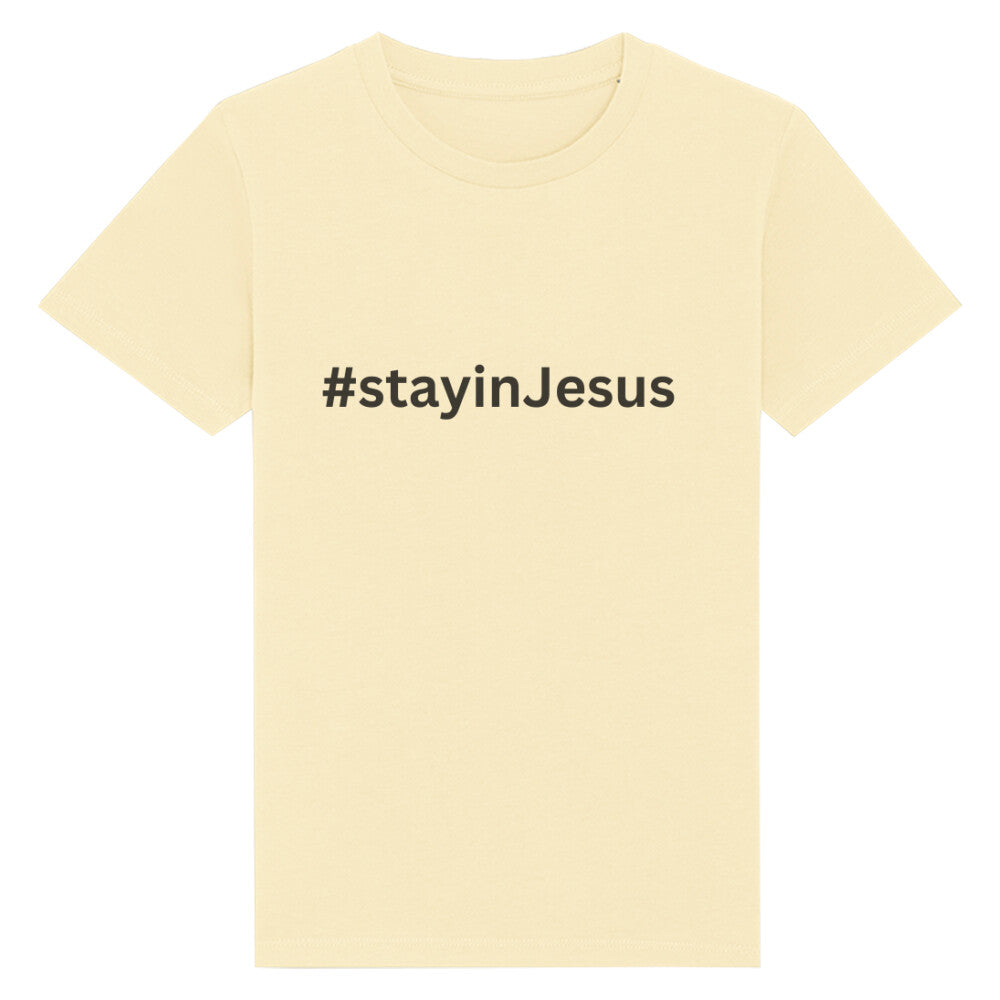 christliches T-Shirt für Kinder mit einem Unisex-Schnitt in hellgelb aus 100 % Bio-Baumwolle mittig auf der Brust "#stay in Jesus". Erhältlich in den Größen 98/104 bis 152/164