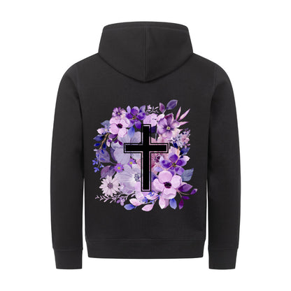 christlicher Hoodie mit einem Unisex-Schnitt in schwarz aus Bio-Baumwolle auf dem Rücken mit vielen Blumen und im Vordergrund ein Kreuz aus unserer Streetwear Kollektion. Erhältlich in den Größen XS bis XXL